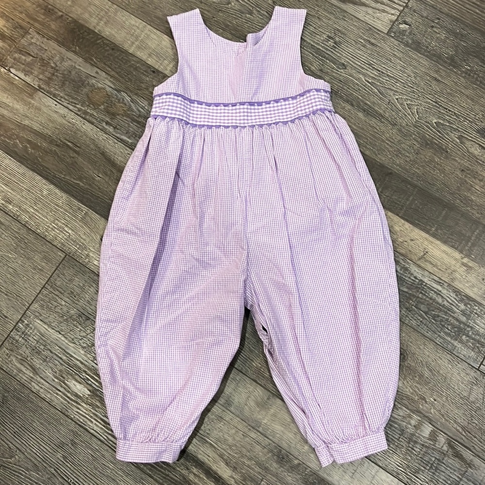 One piece romper with snap button closure on bottom